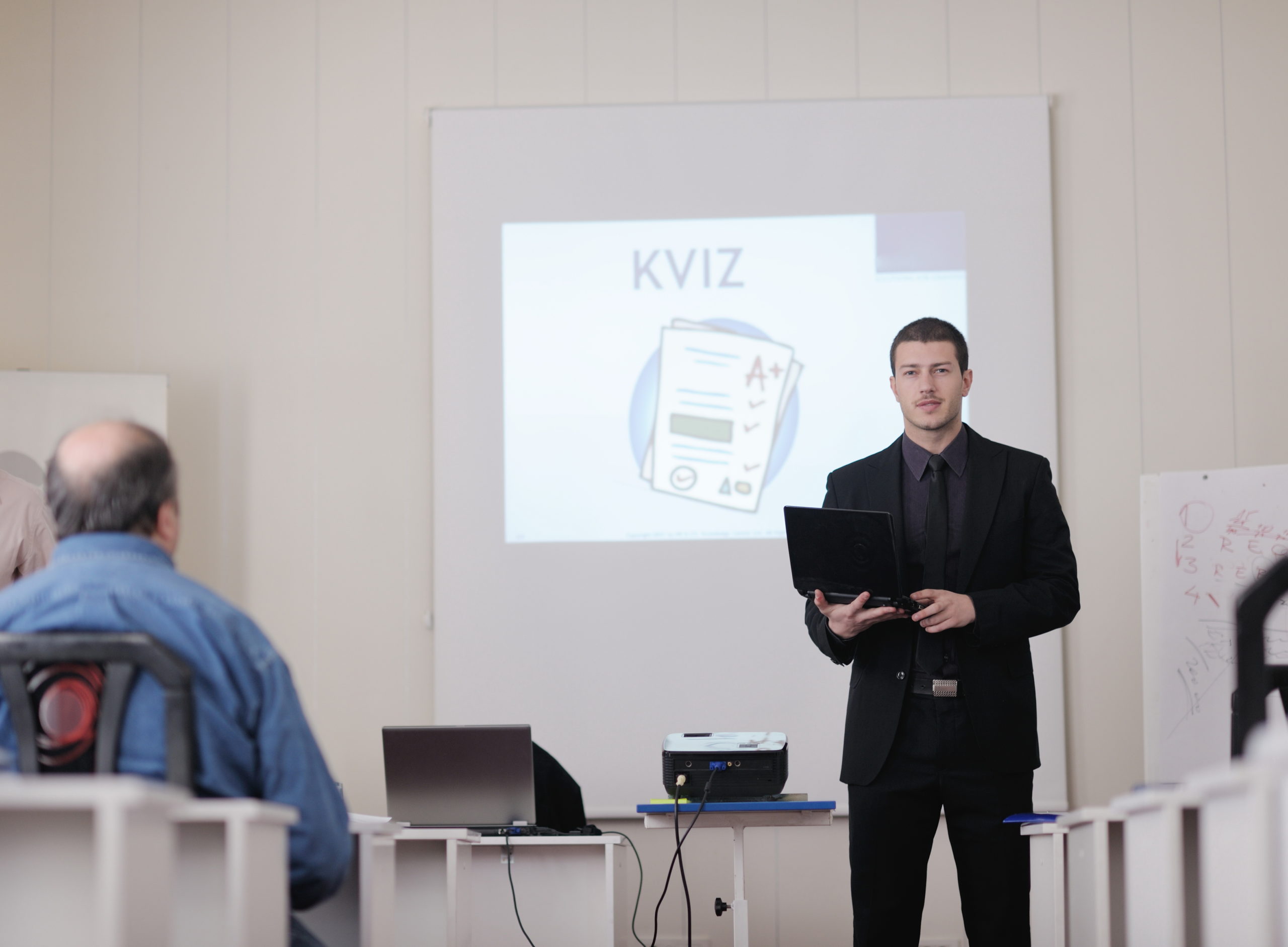 young business man giving presentation and education leassons on seminar event in small bright conference room